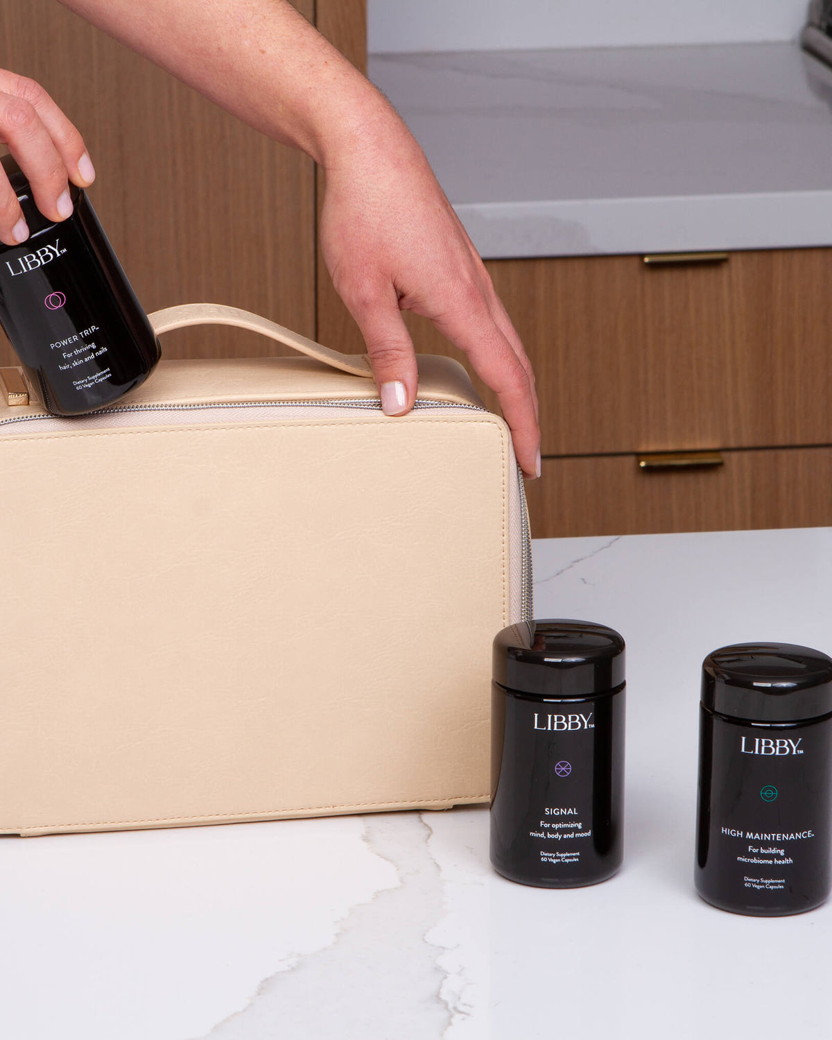 The 90-day Libby System bottles being placed in a peach bag. 