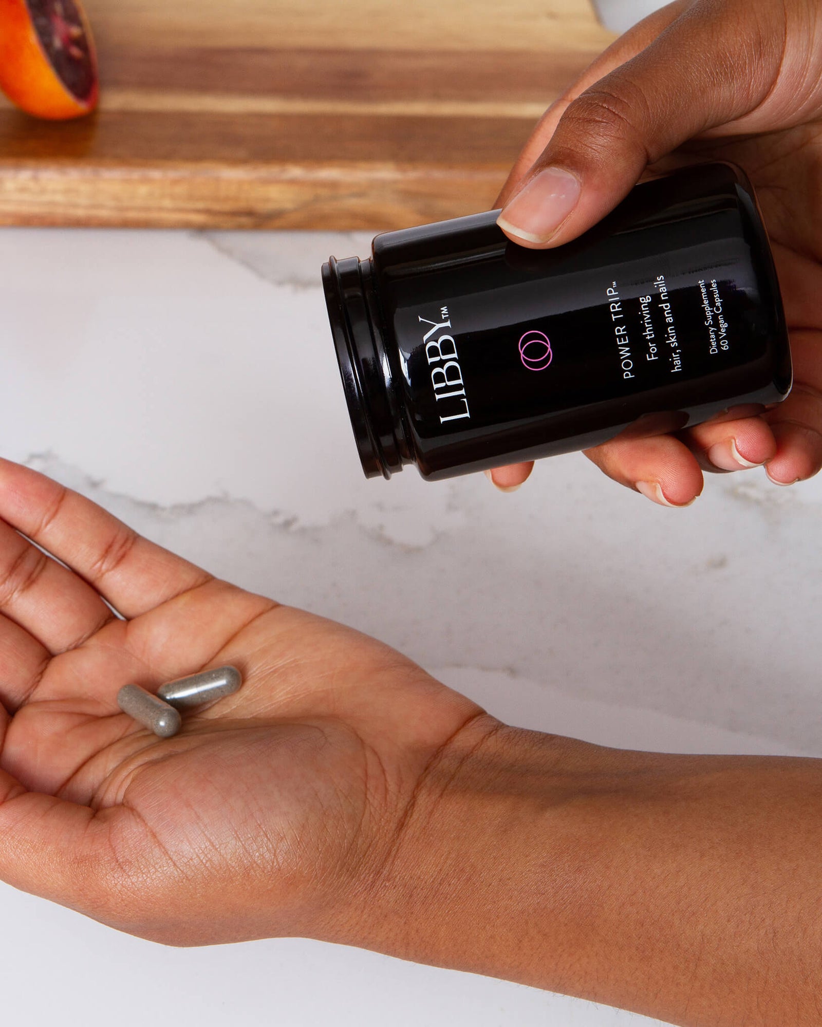 Power Trip supplement from Libby in black bottle on white background.