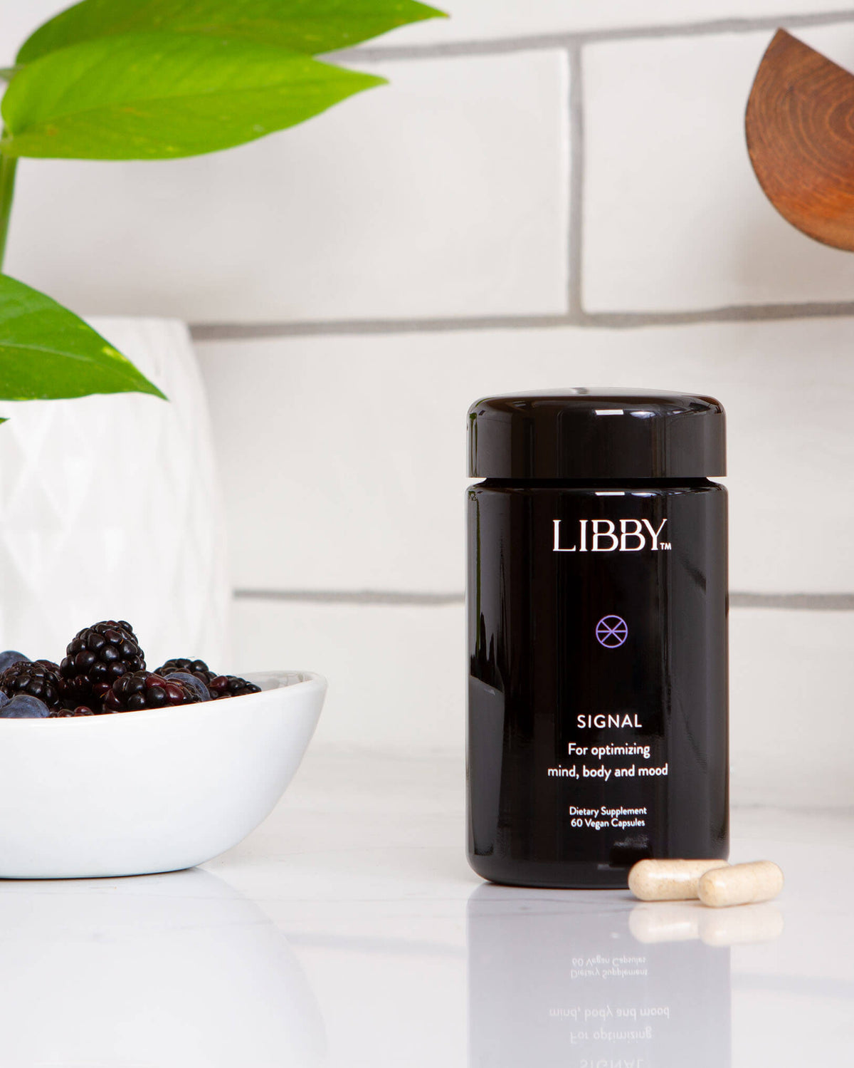 Signal supplement from Libby in a premium black bottle in a kitchen setting.